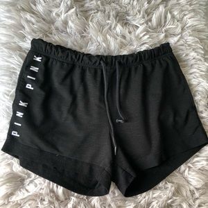 pink black shorts and sweats